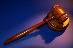 Gavel on a blue background