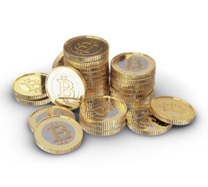 Stack of gold and silver toned coins representing Bitcoin.