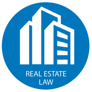 Graphic of white buildings on blue circle background, with "real estate law" written in white