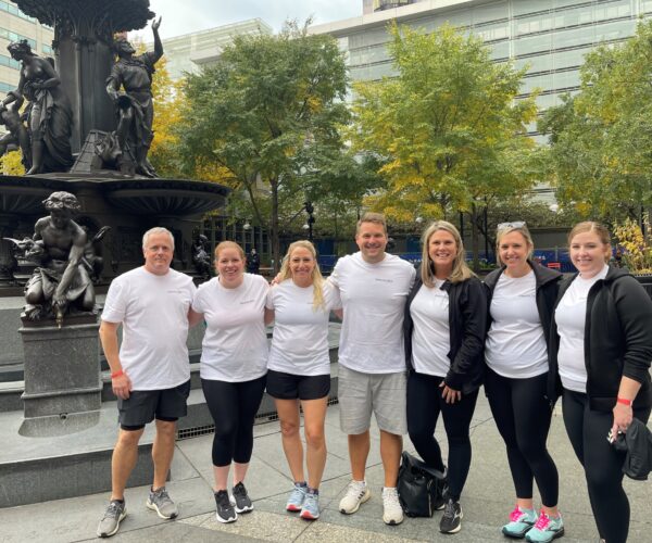 Strauss Troy team for heart stationary bike event on Fountain Square.